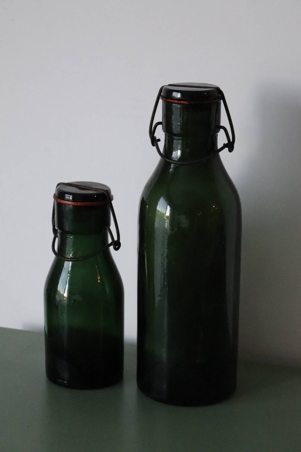 Pair of old green glass jars/bottles – models 1/2 and 1 1/