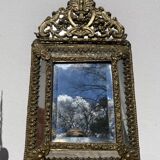 Golden mirror with 19th century embossed brass beads