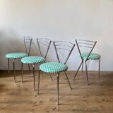 4 chrome chairs with green and white checkered tiles