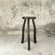 Vintage tripod plant stand with curved legs.