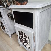 Two solid wood bedside tables with calfskin decoration.