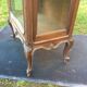 Louis XV Rocaille style showcase in solid walnut, beveled door glass.