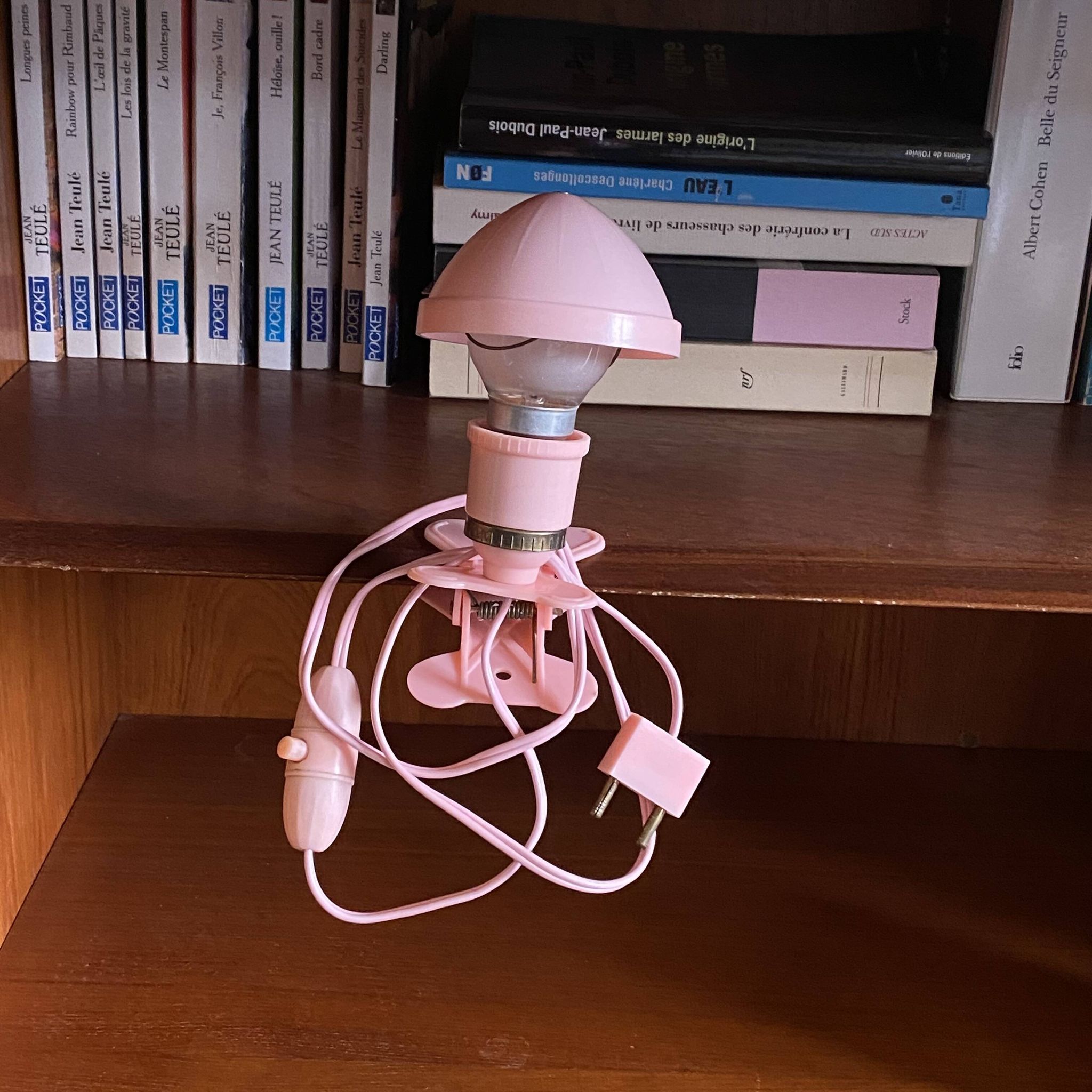 Small portable pink plastic mushroom clip-on lamp