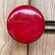 Wall coat holder in vintage red metal.