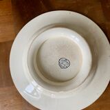 Ancien plat sur pied terre de fer en faïence de Salins