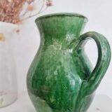 Antique green pitcher in painted terracotta