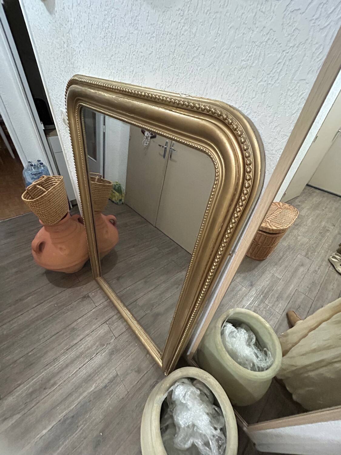 Antique gilded mirror in old Louis Philippe wood