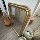 Antique gilded mirror in old Louis Philippe wood