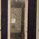 Napoleon III style mirror and woodwork console in 19th century patinated wood