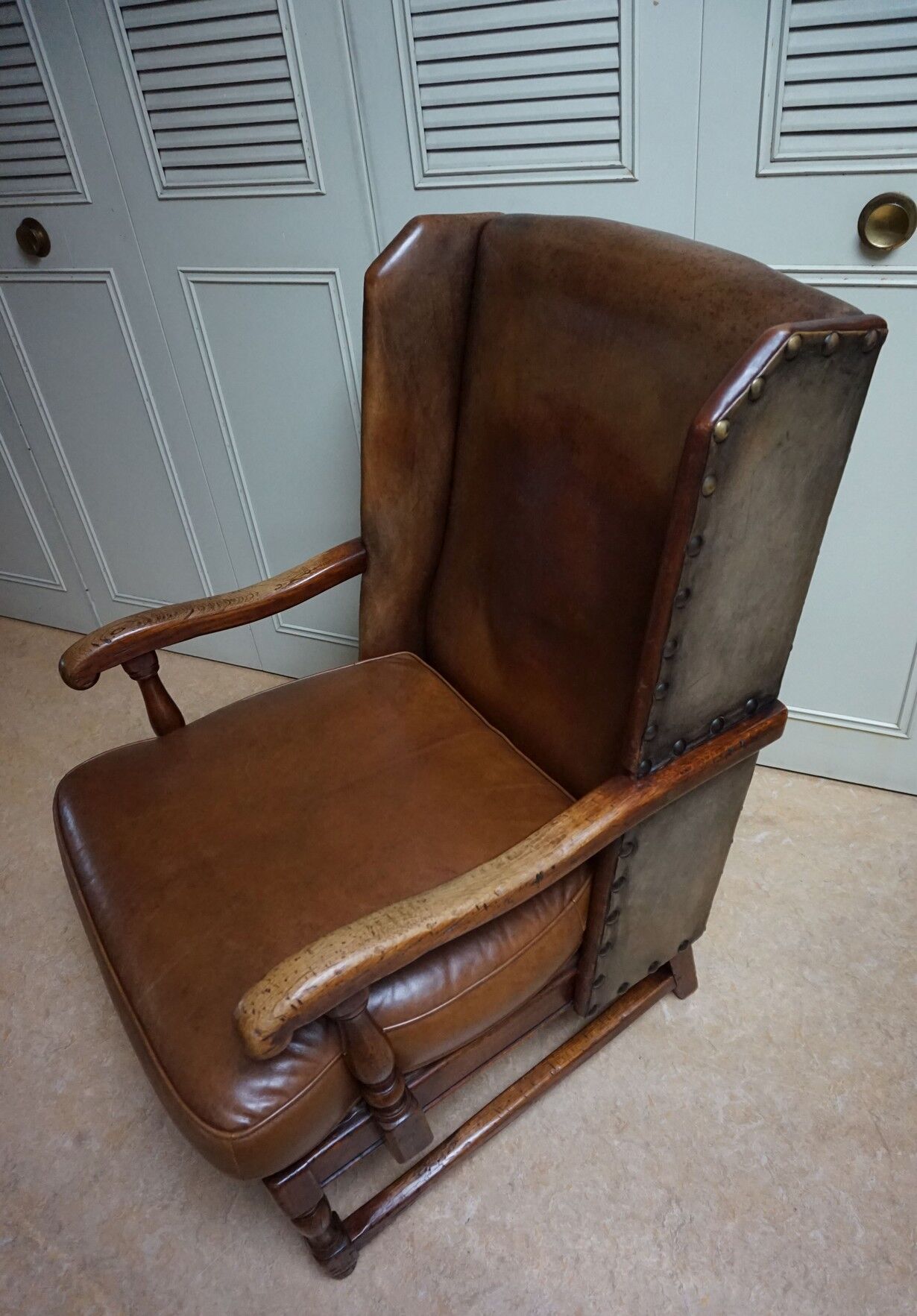 English high back cognac leather wingchair by Criterion cord