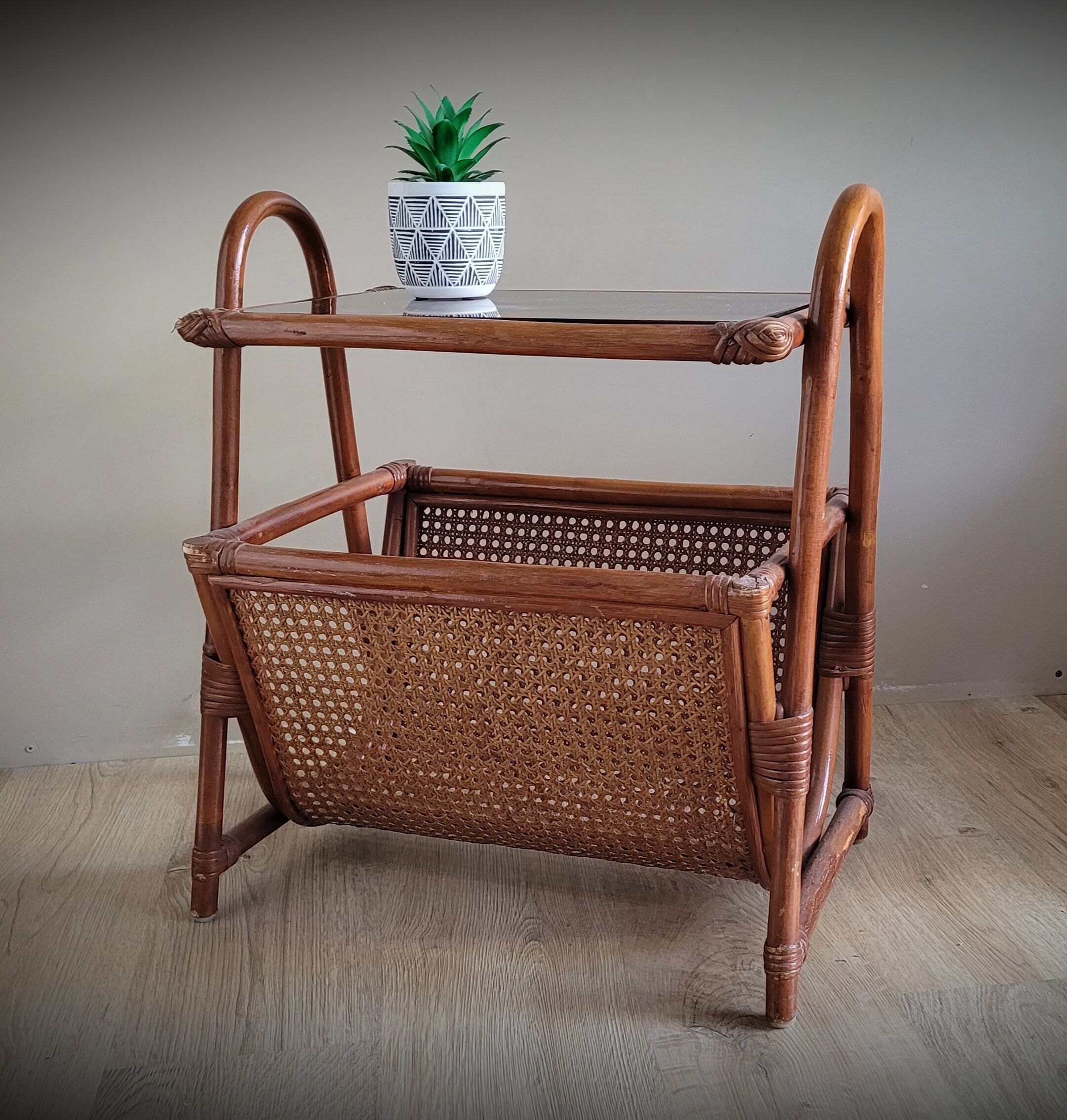Braided rattan side table and smoked glass