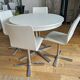 Extendable round table in white formica and 4 matching chairs by Roche Bobois.