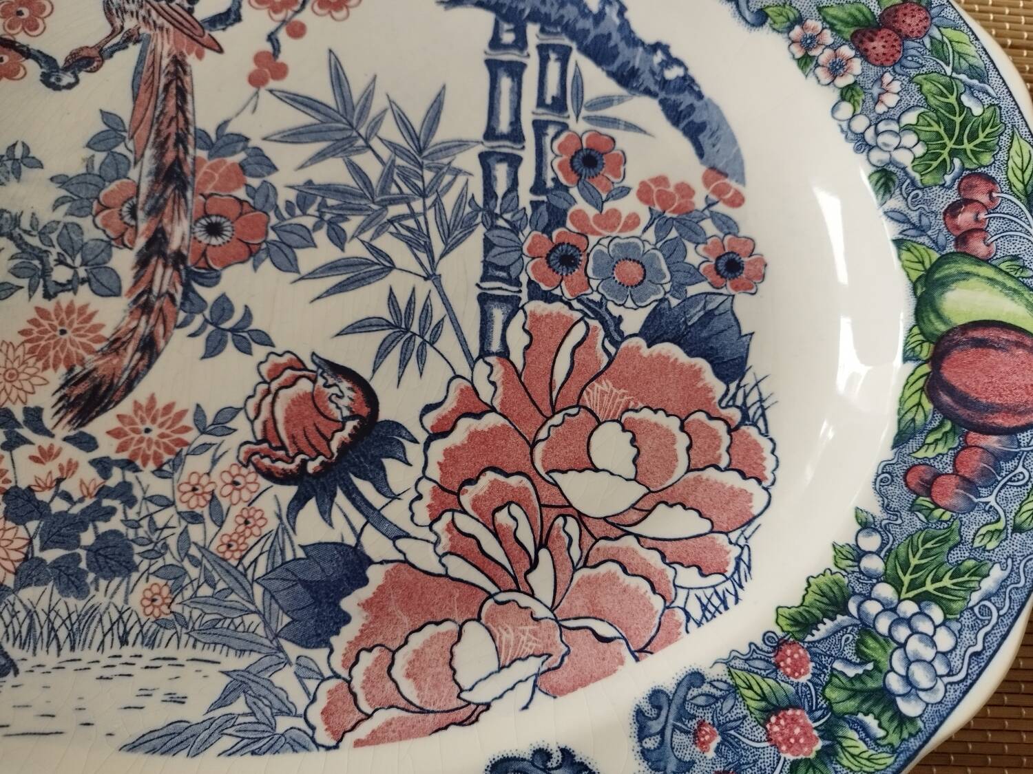 Oval Japanese plate with peacock decoration.