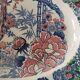 Oval Japanese plate with peacock decoration.