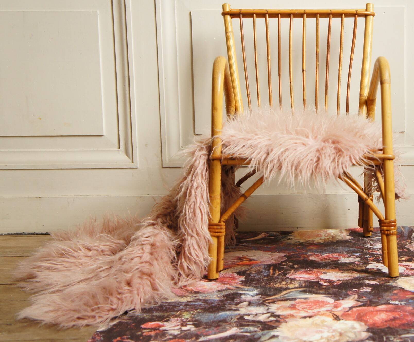 Children's rattan armchair & its old pink skin