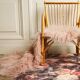 Children's rattan armchair & its old pink skin