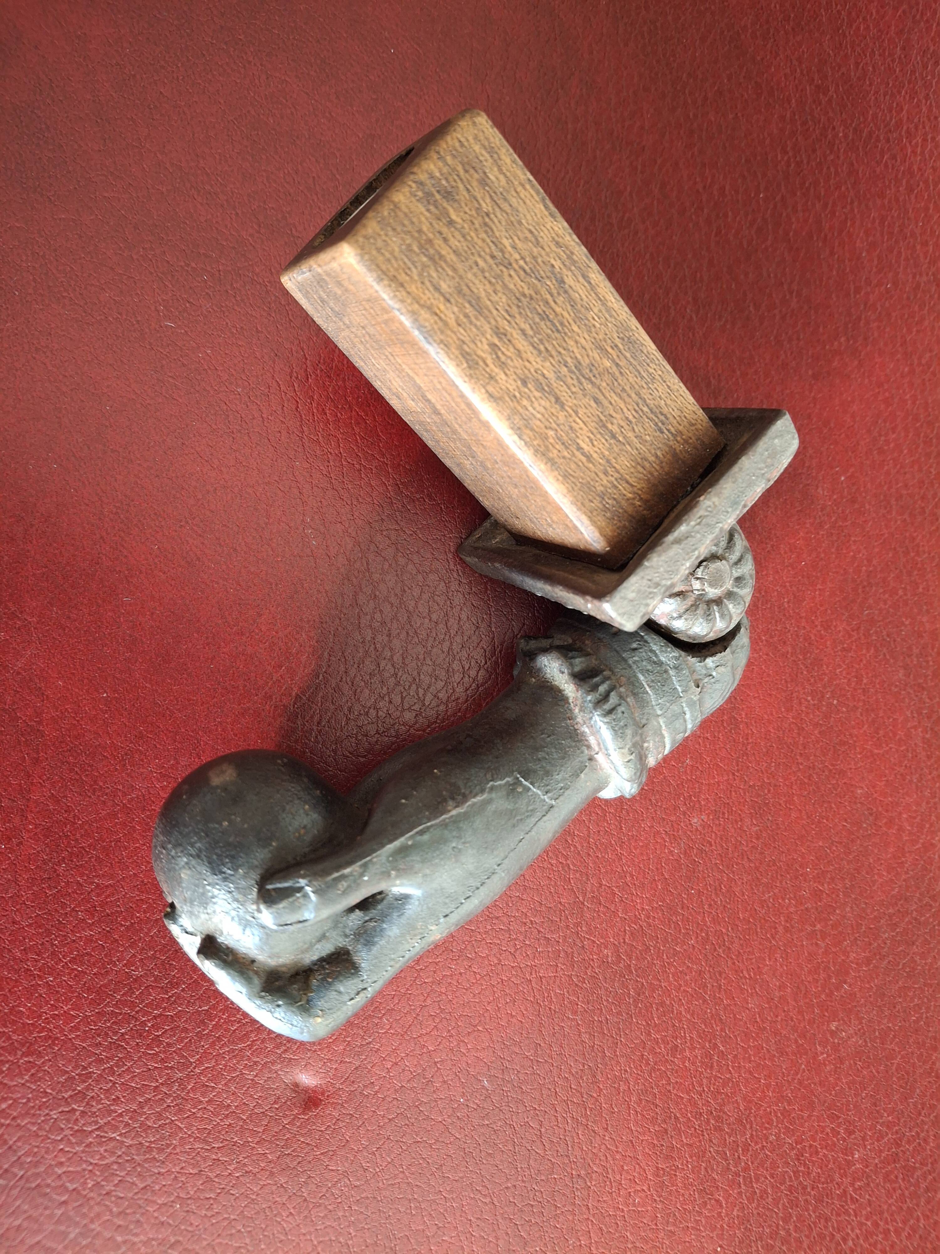 Cast iron door knocker from the 19th century or earlier.