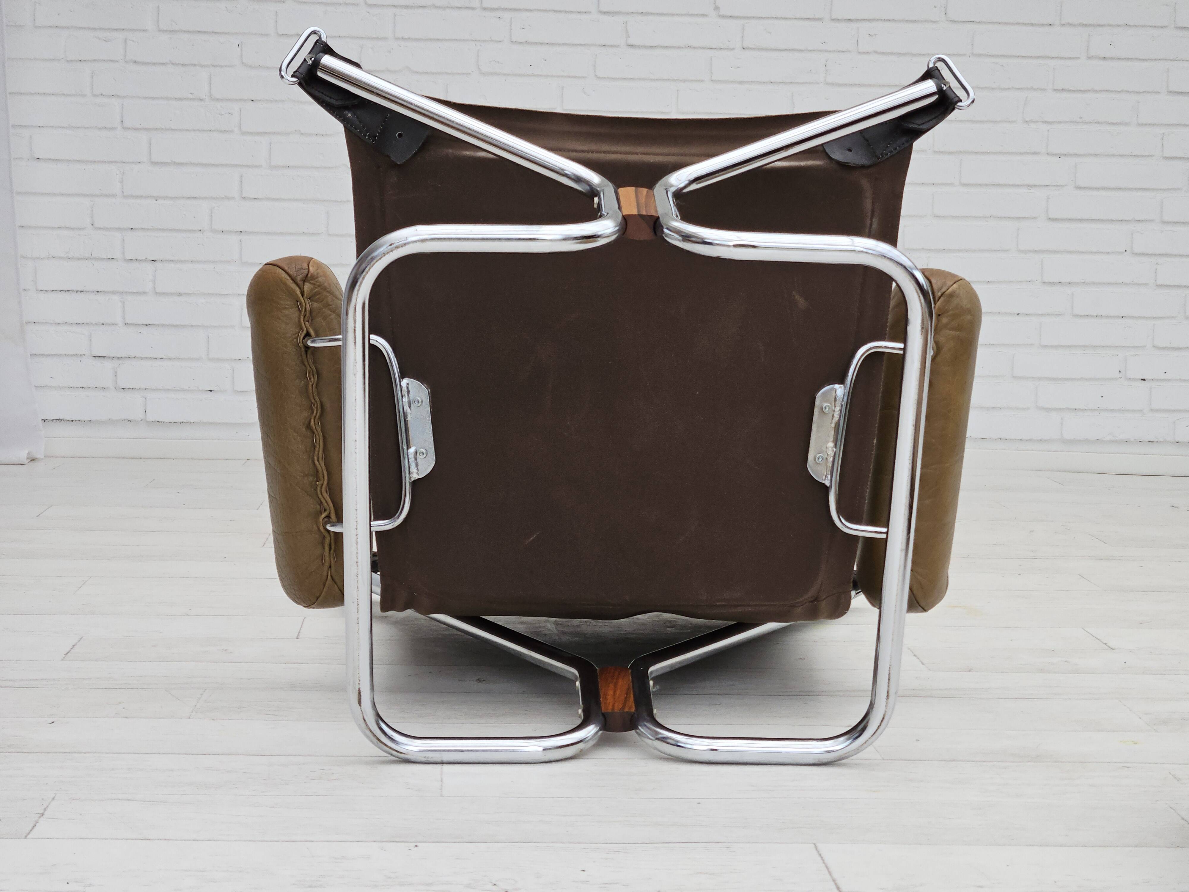 1970s, Norwegian design by Harald Relling, original condition, leather, chrome steel, teak wood.