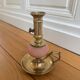 Pink glass and brass candlestick