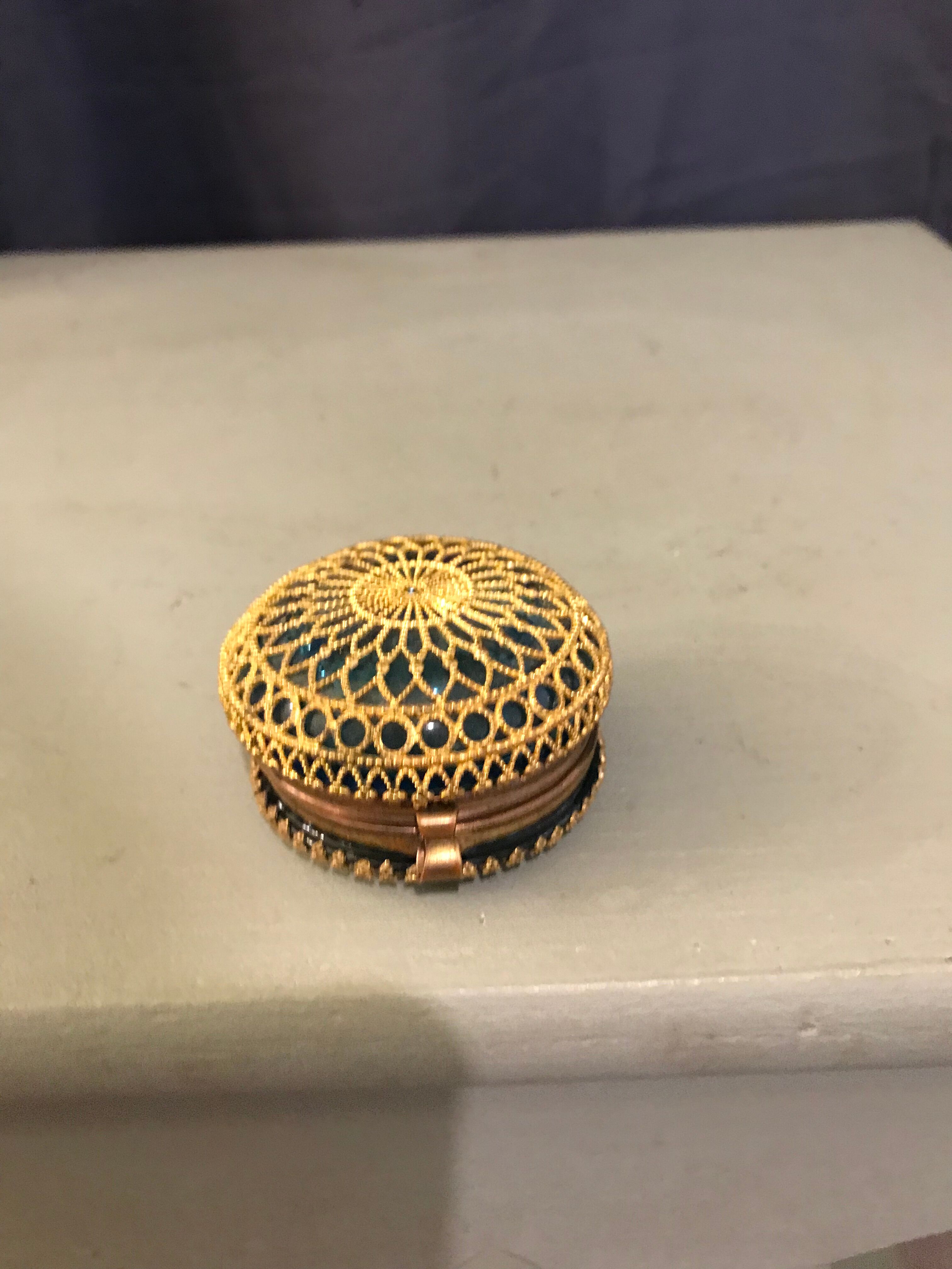 Old pill box made of golden thread