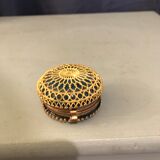 Old pill box made of golden thread