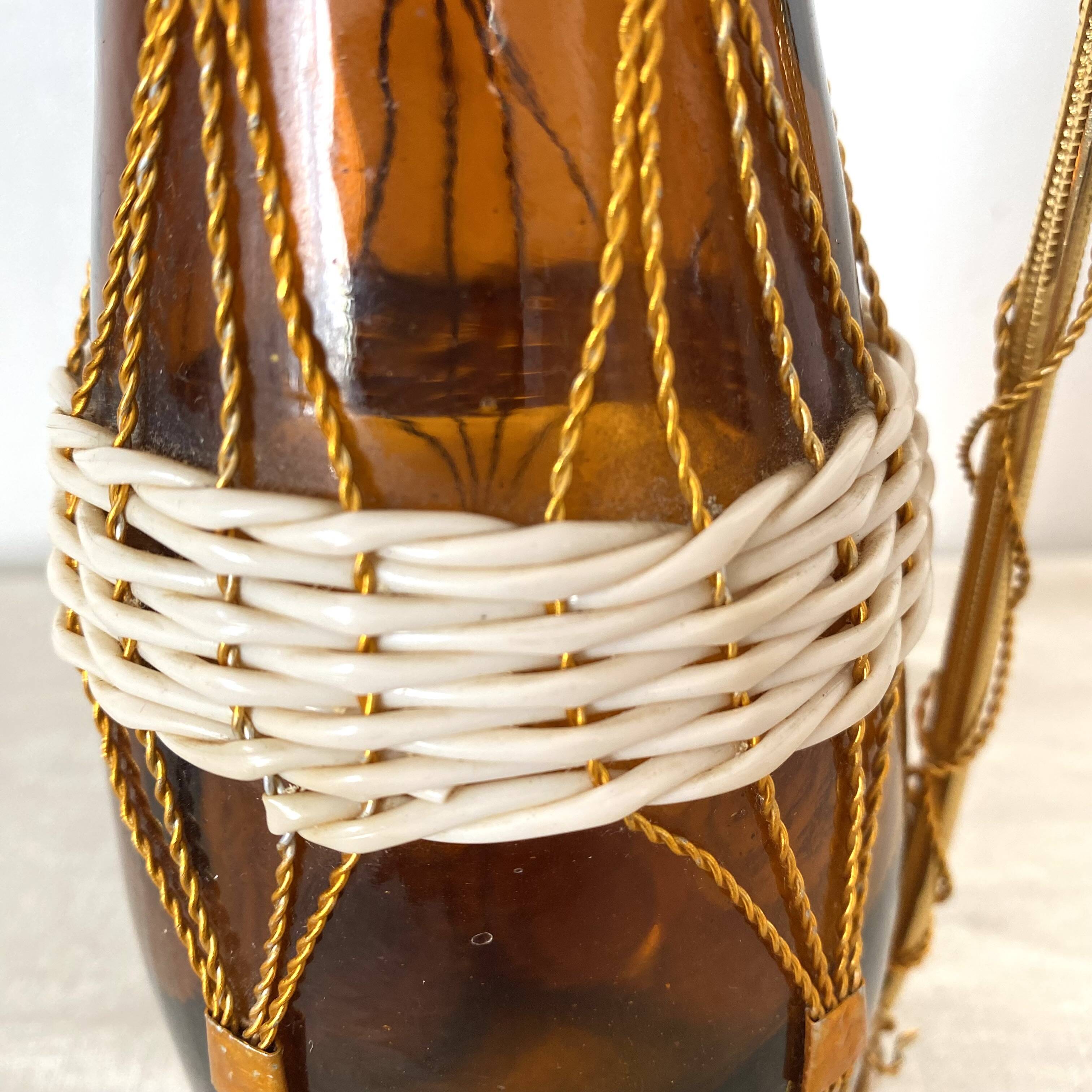 Amber glass bottle and scoubidou