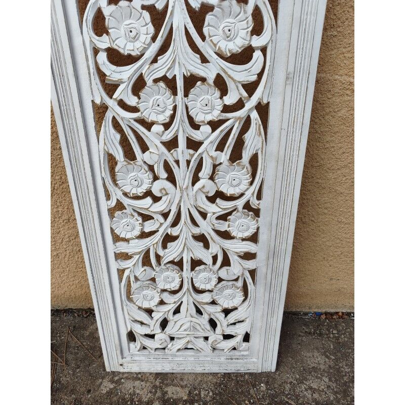 Decorative wooden panel with carved and openwork design.