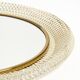 Mid Century Modern round wall mirror with a white expanded metal frame