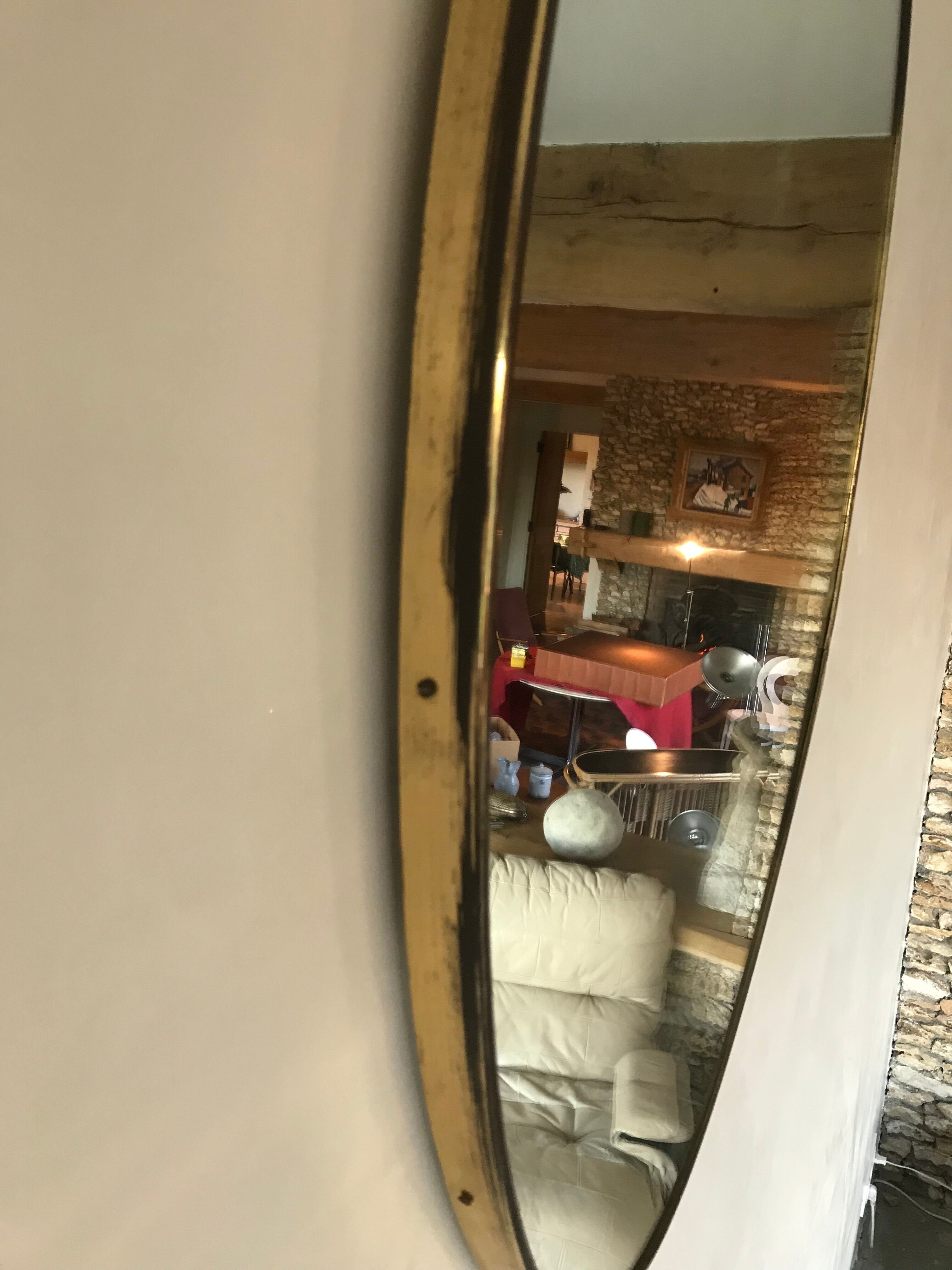 Oval brass mirror, Italy, circa 1960.
