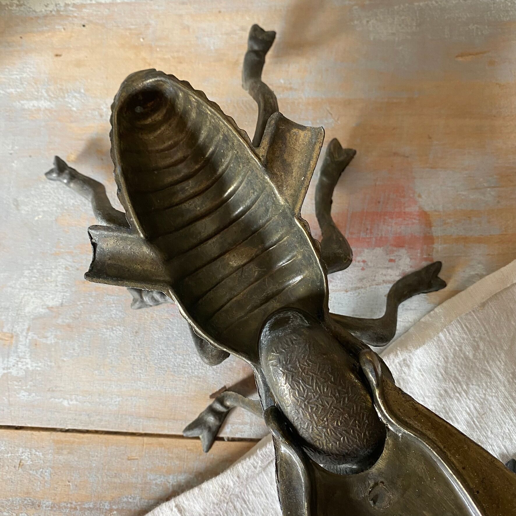 2 metal ashtrays with insect fly designs from the 1950s-60s.