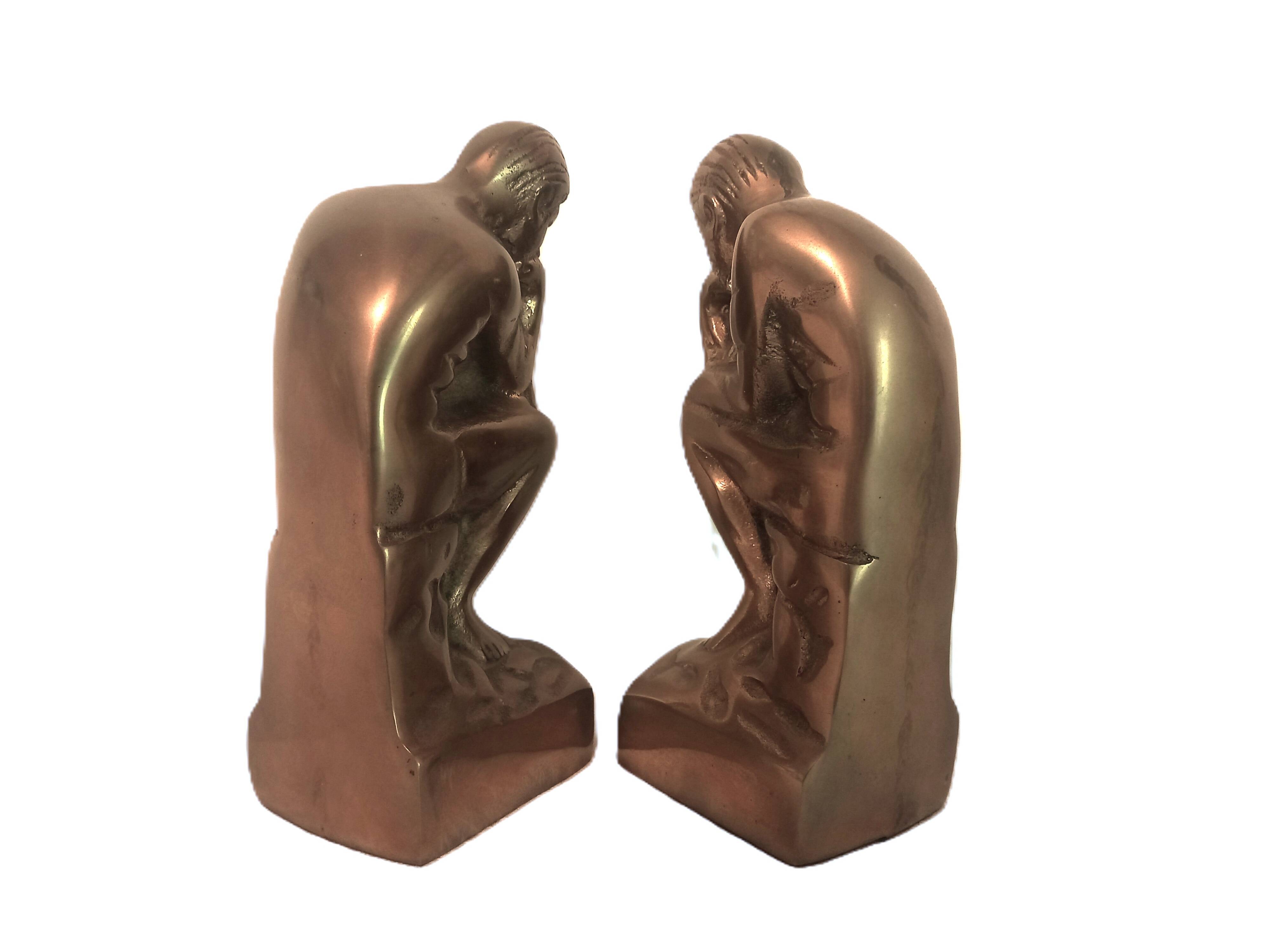 Pair of brass "thinker" bookends