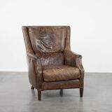 Very comfortable vintage cow leather armchair with beautiful colours