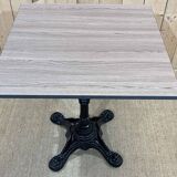 Modern bistro table, cast iron base, laminated top