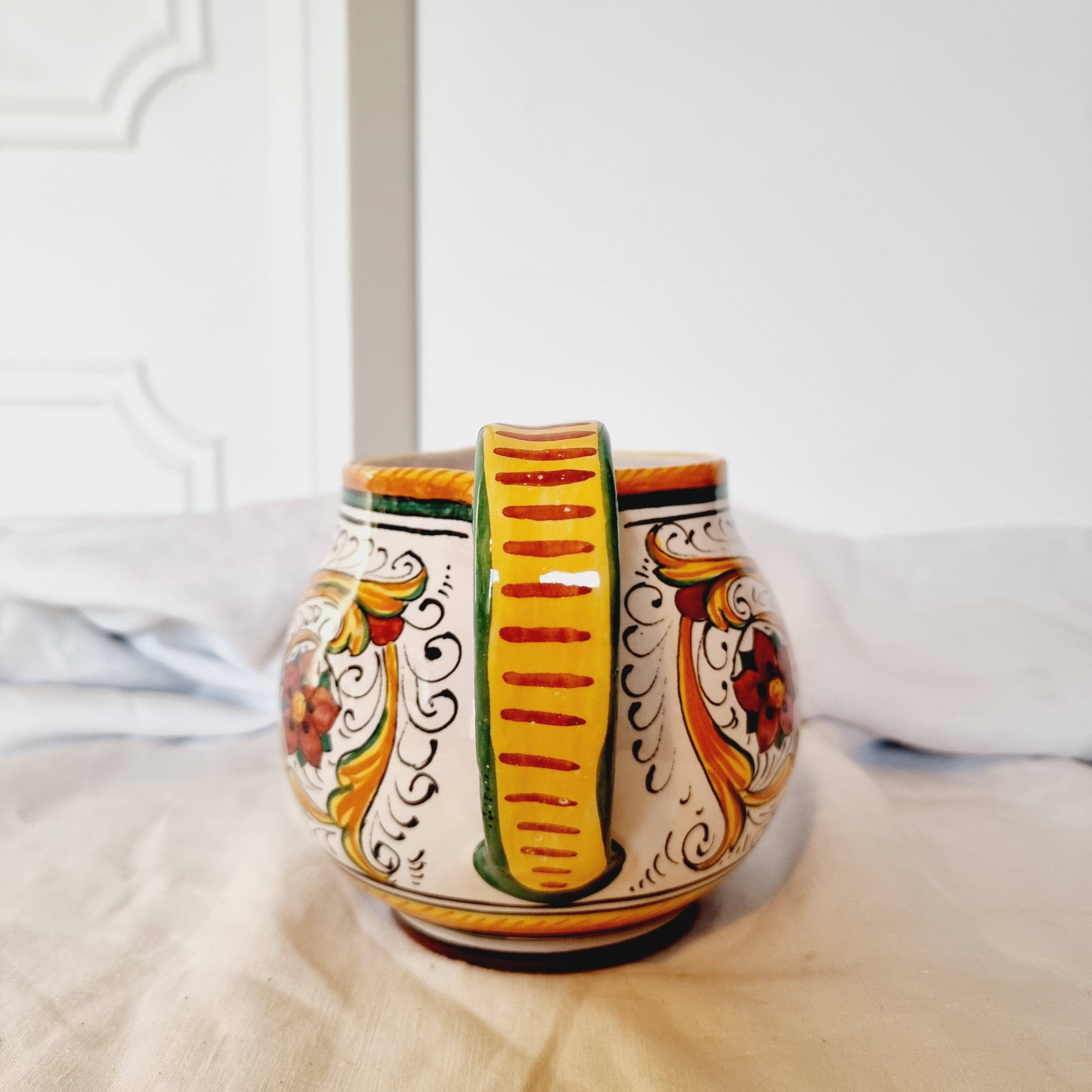 Majolica ceramic jug by R. Deruta, Italy, hand-painted, with a long spout.  Decorated with a dragon tree