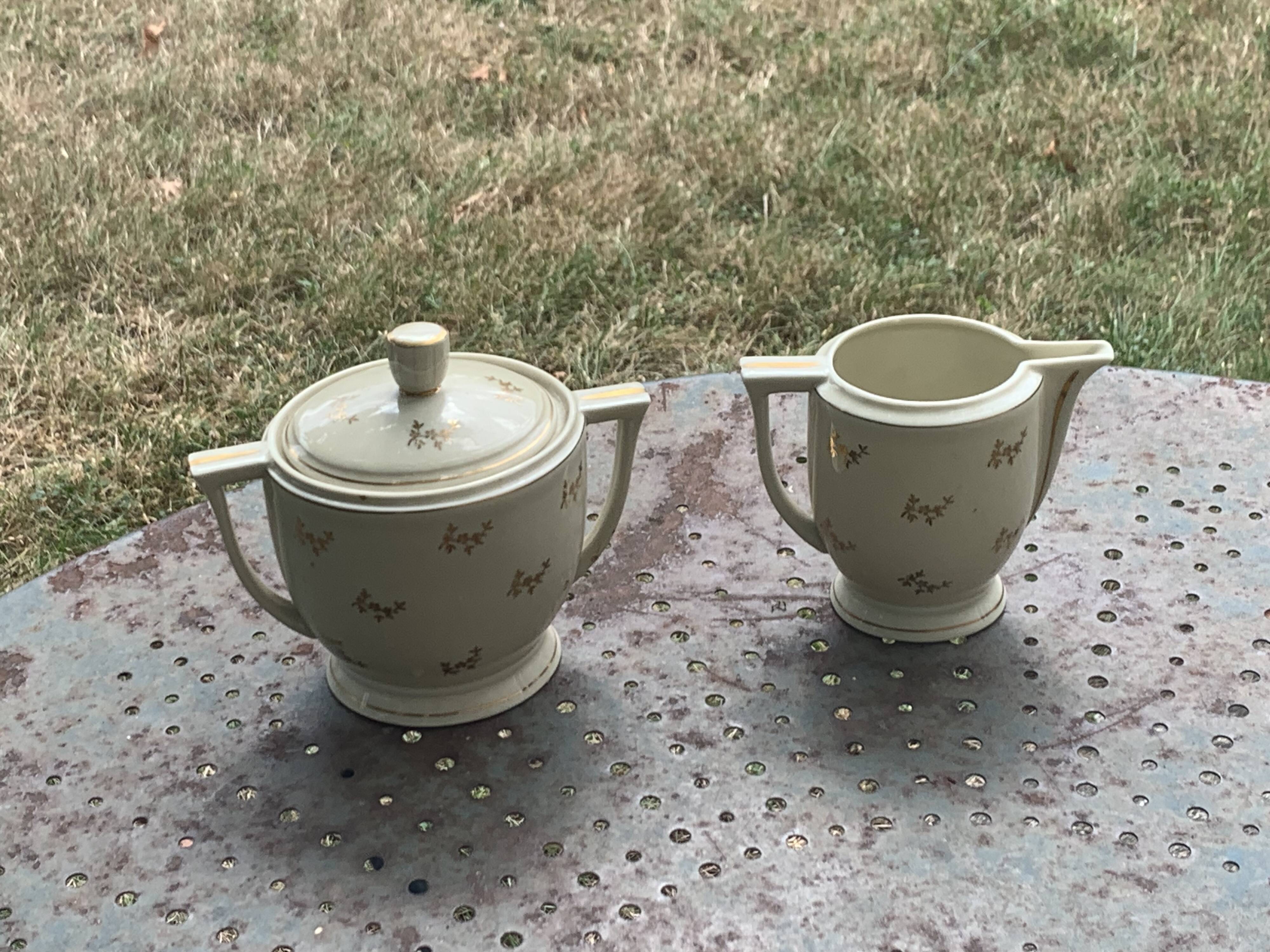 Antique porcelain sugar bowl and milk jug from the Royal Factory of Limoges, France