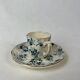 White porcelain cup with blue flowers