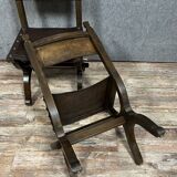 Pair of medieval style chairs in solid wood and leather, 19th century, circa 1850