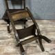 Pair of medieval style chairs in solid wood and leather, 19th century, circa 1850