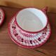 Henriot in Quimper - Set of 2 cups and saucers with a floral design.