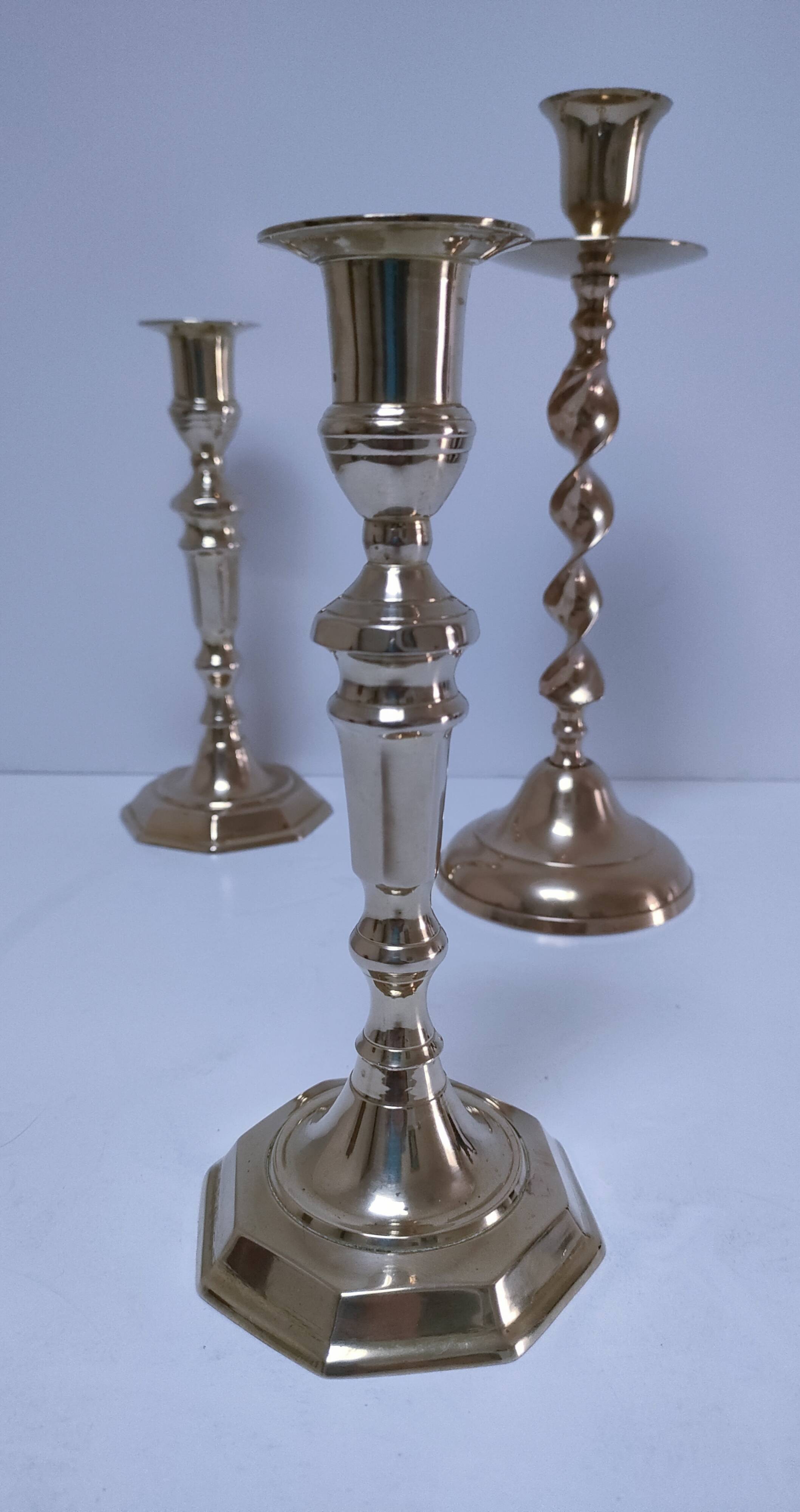 Three vintage solid brass candle holders