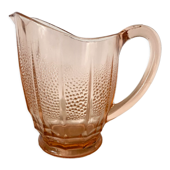 Antique pitcher in pink glass