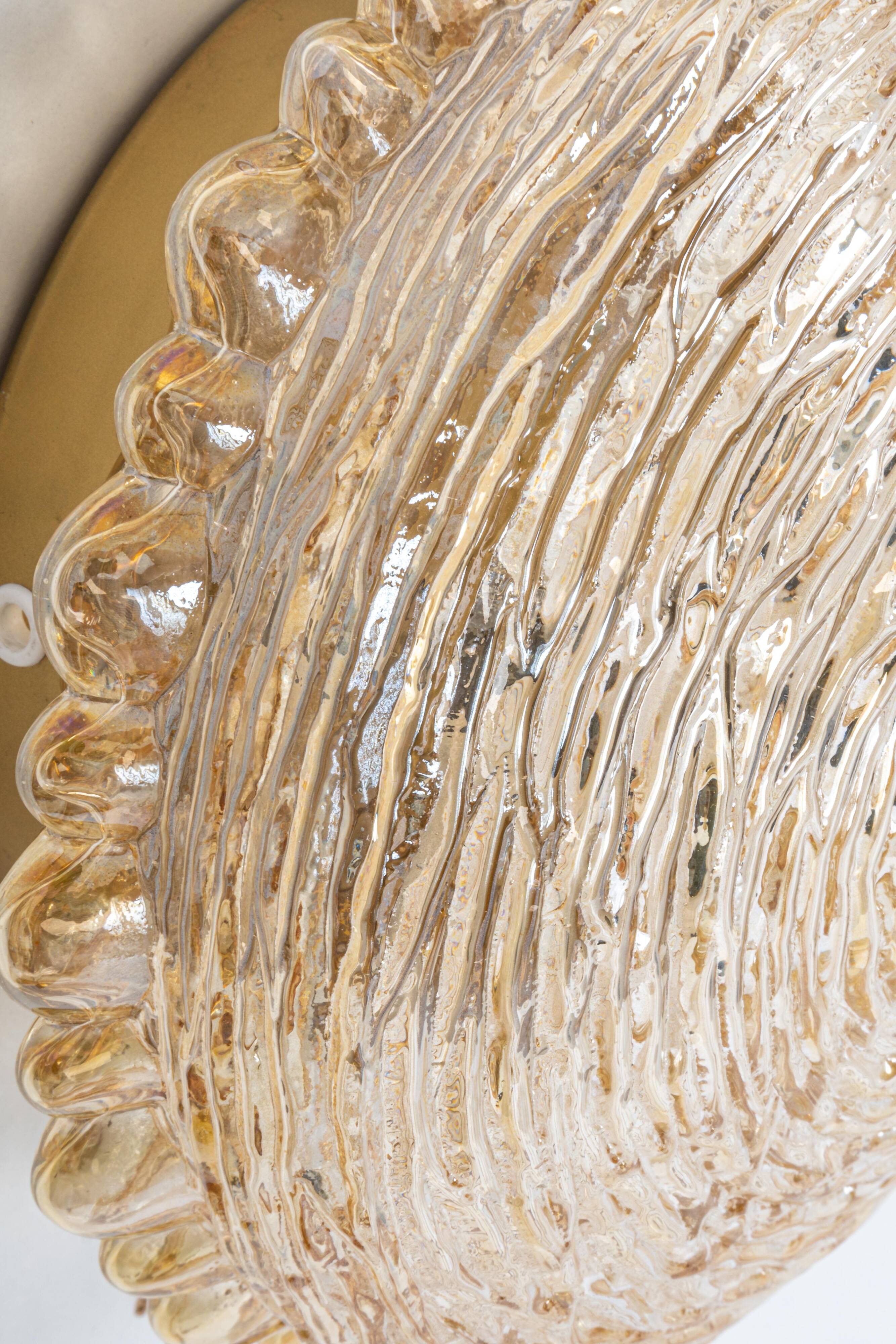 Amber glass wall sconces in the shape of a fingerprint, Germany, 1970s.