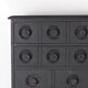 Blackened wooden chest of drawers