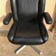 Vintage swivel black leather armchair