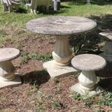 Old garden furniture in reconstituted stone