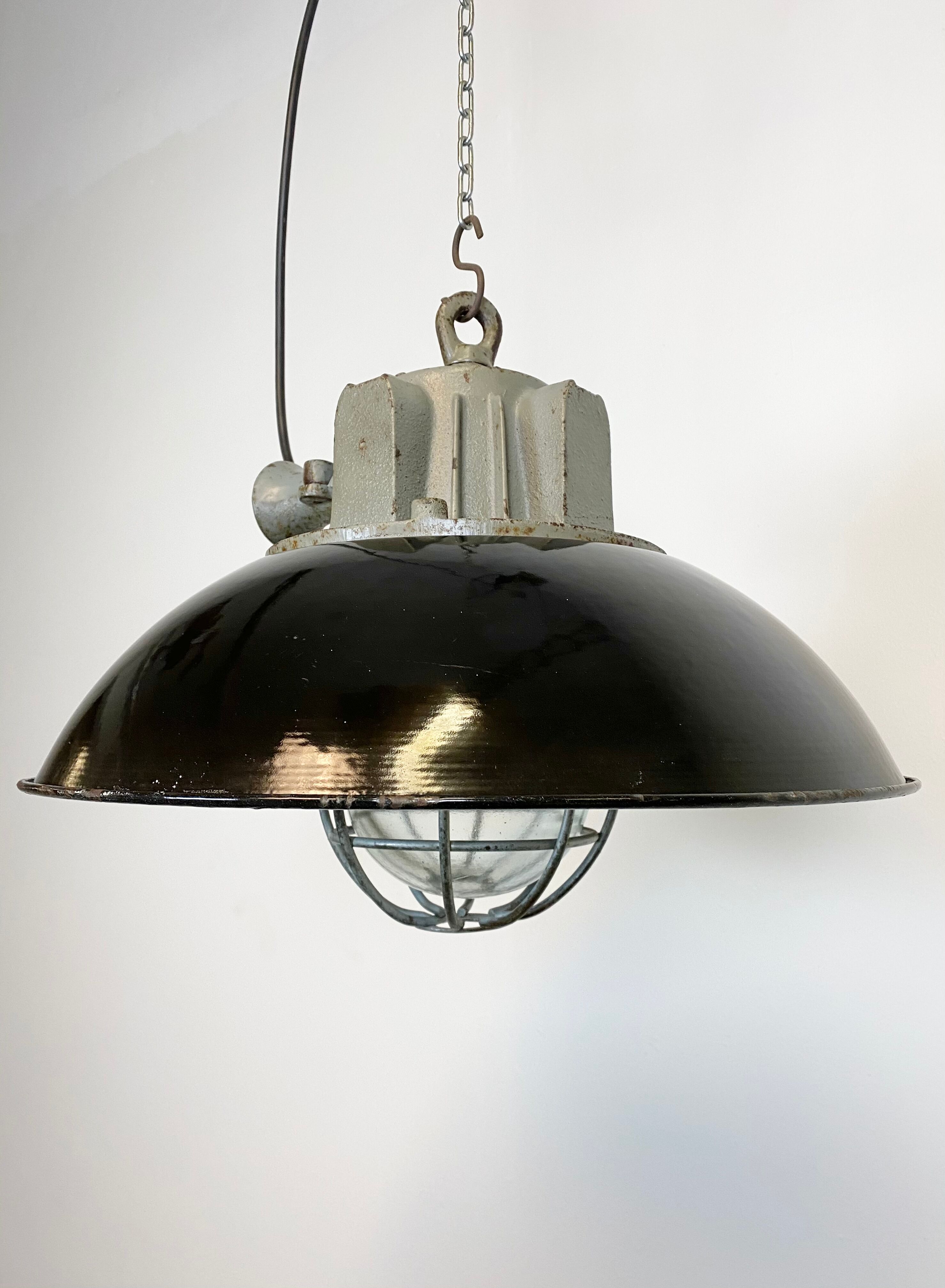 Black enamel and cast iron industrial cage pendant light , 1950s