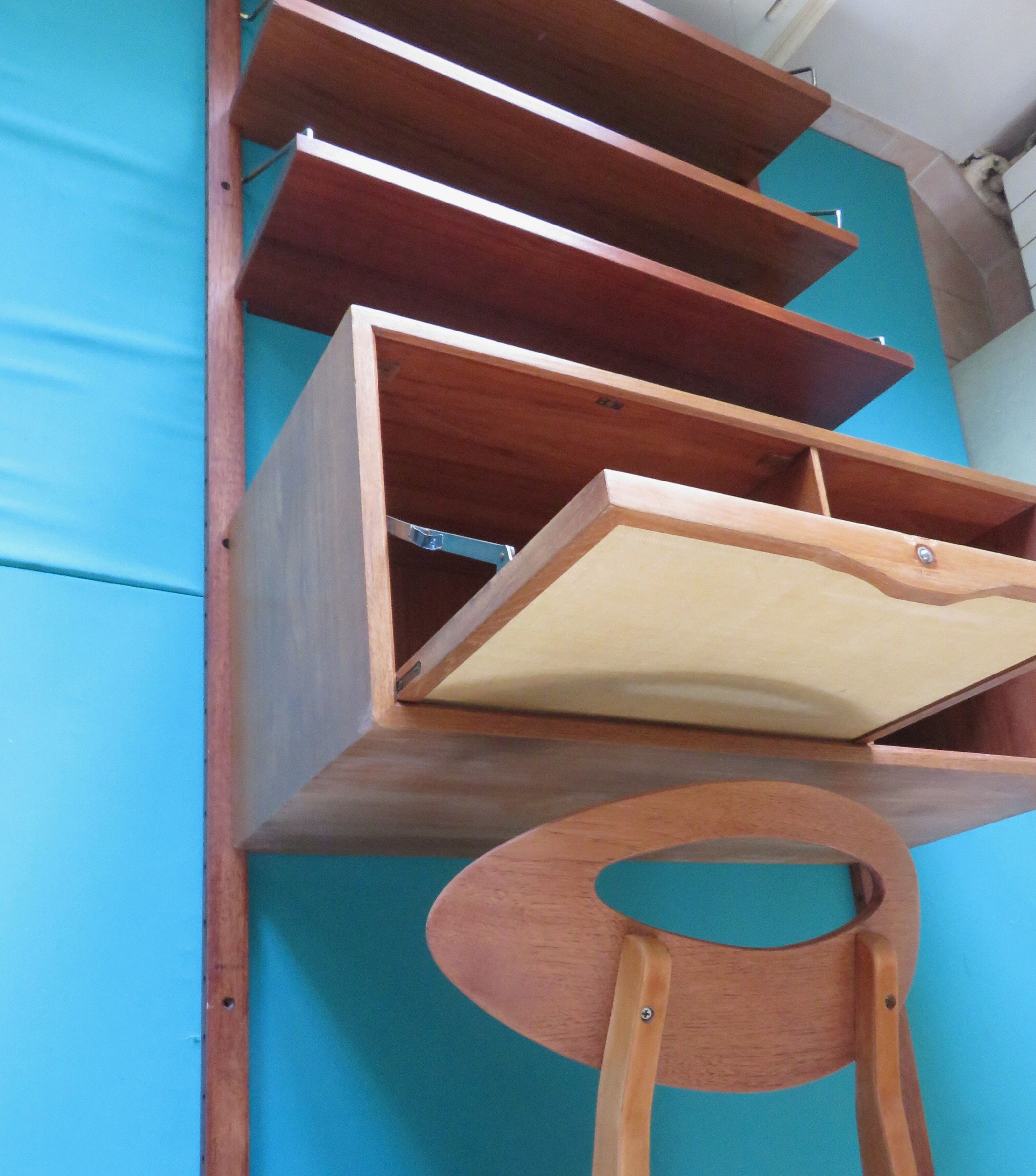 Wall shelving system and teak writing box. of Poul Cadovius. Denmark 1960