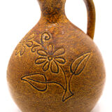 Brown pitcher and saffron yellow with naïve flowers of Accolay