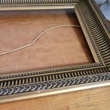 Frame with channels in wood and gilded stucco