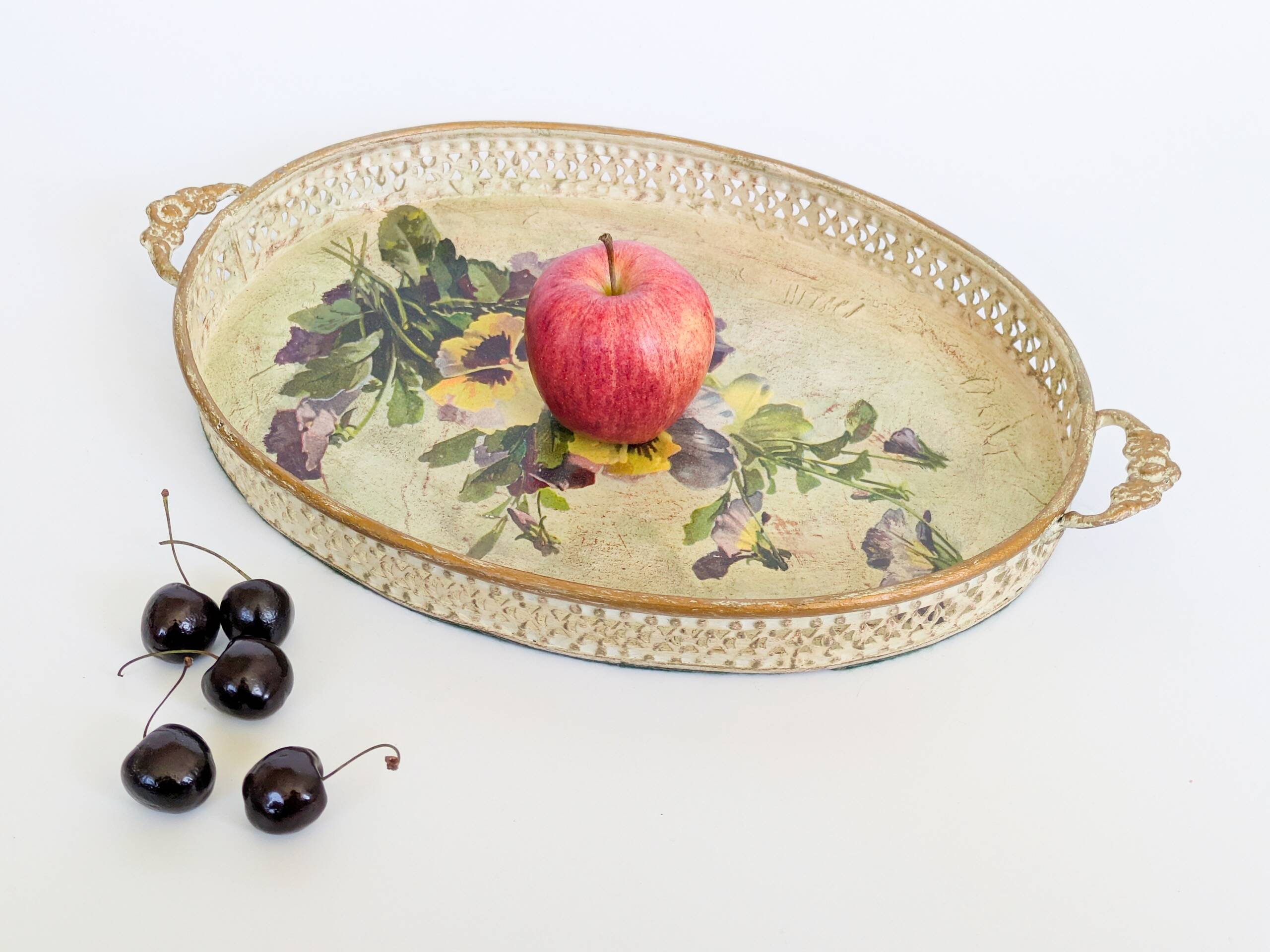 Oval metal decorative vintage tray with floral pattern.